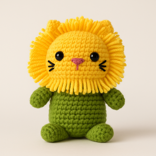 A cute, handmade crochet lion doll with a bright yellow mane and a green body, representing a Free Amigurumi Lion Crochet Pattern.