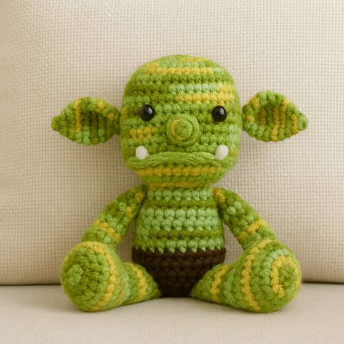 Image of a handcrafted, cute ogre amigurumi toy, created from a Free Cute Ogre Amigurumi Crochet Pattern.